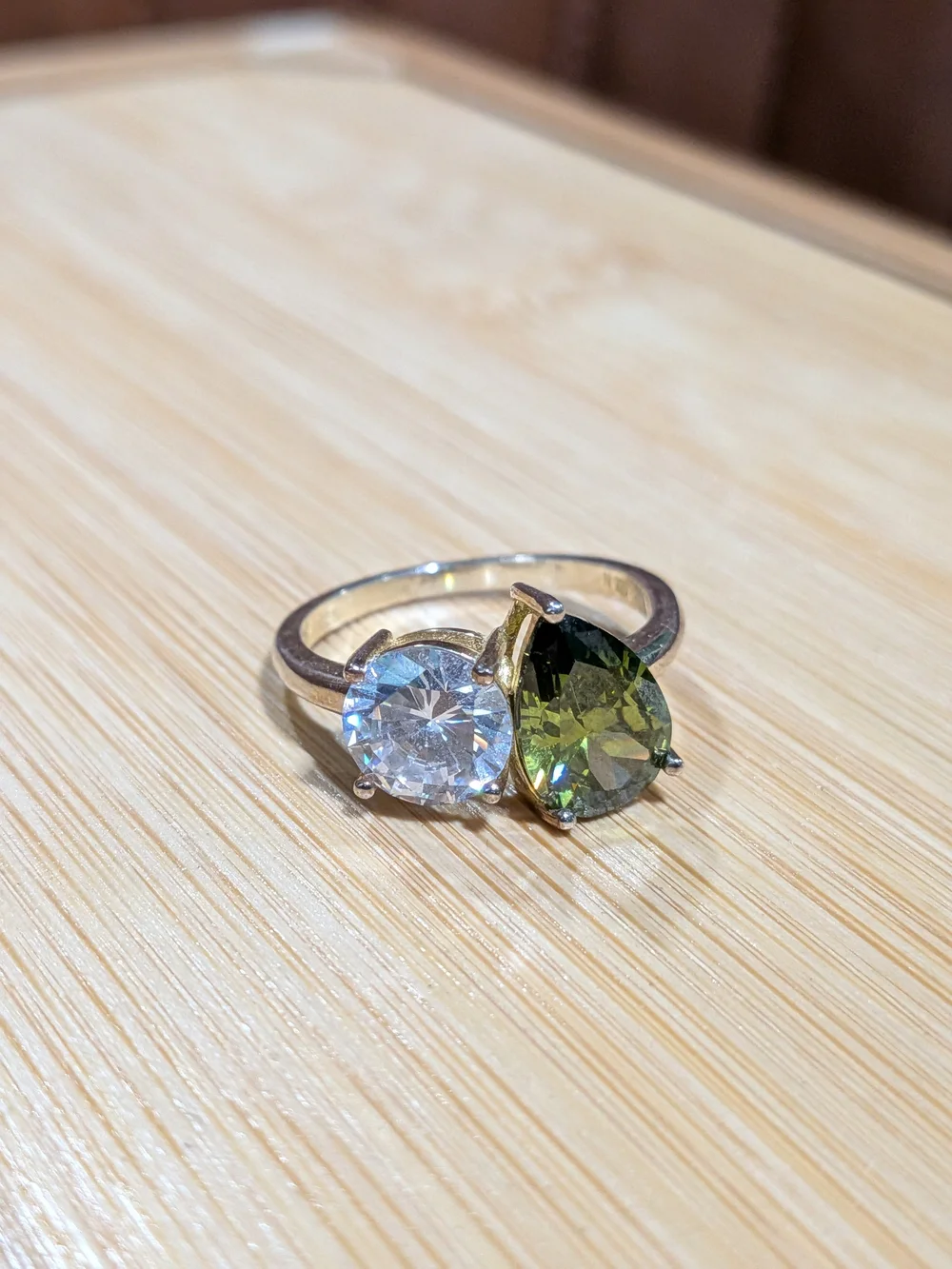 Double Stone Ring with Green Teardrop and Clear Round Gem